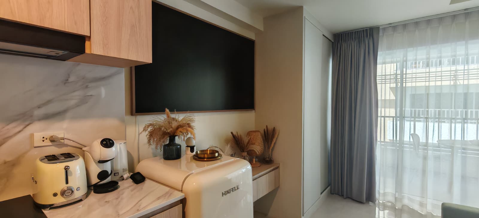 Modern kitchen with TV and retro fridge, studio for sale Koh Samui