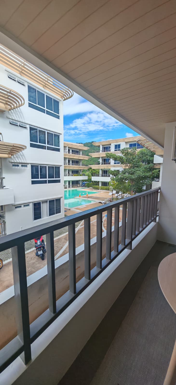 Balcony view toward pool and green hills, Terraza Lamai