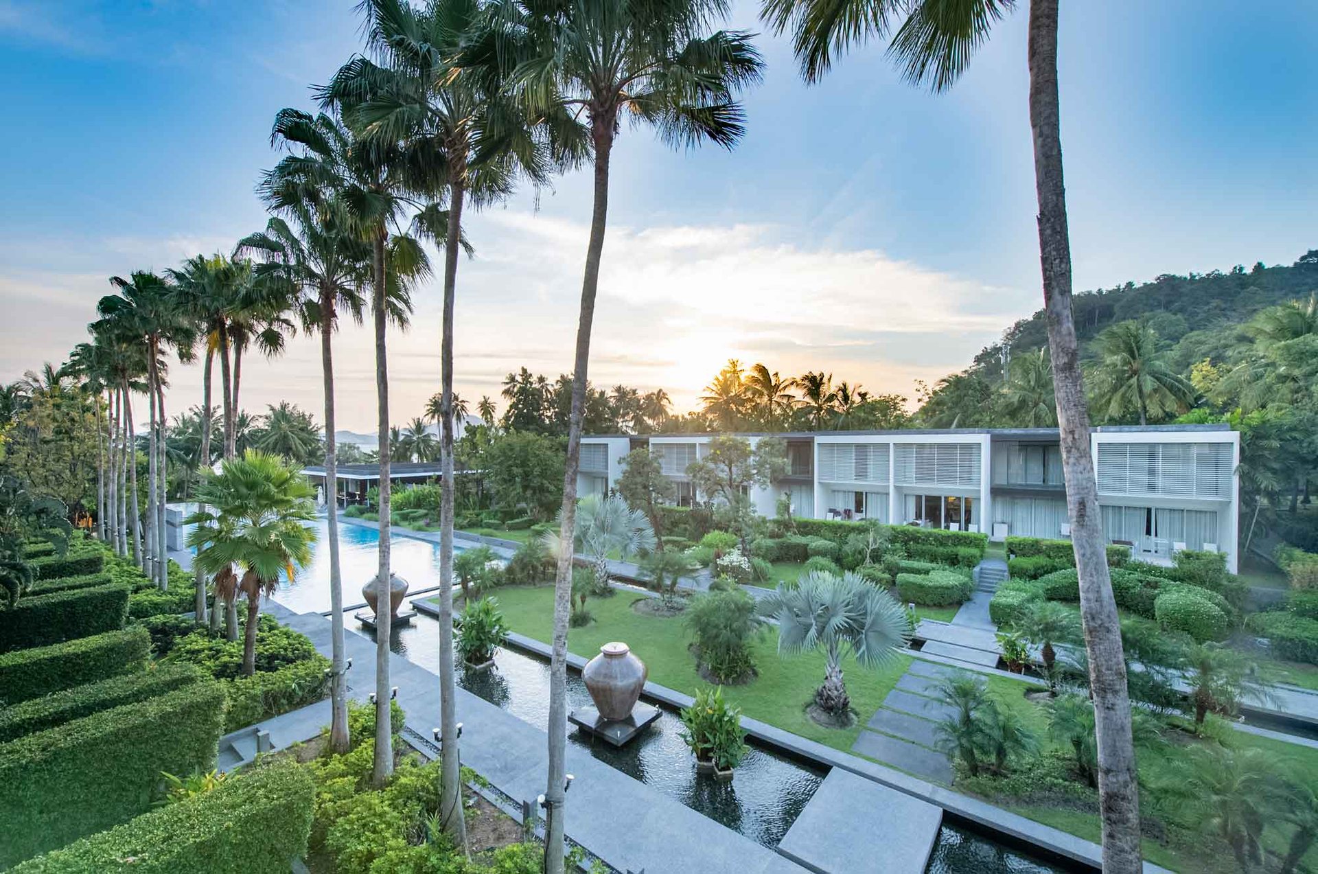 Baan Yamu Residences, Cape Yamu, Phuket – Water gardens with green hills behind