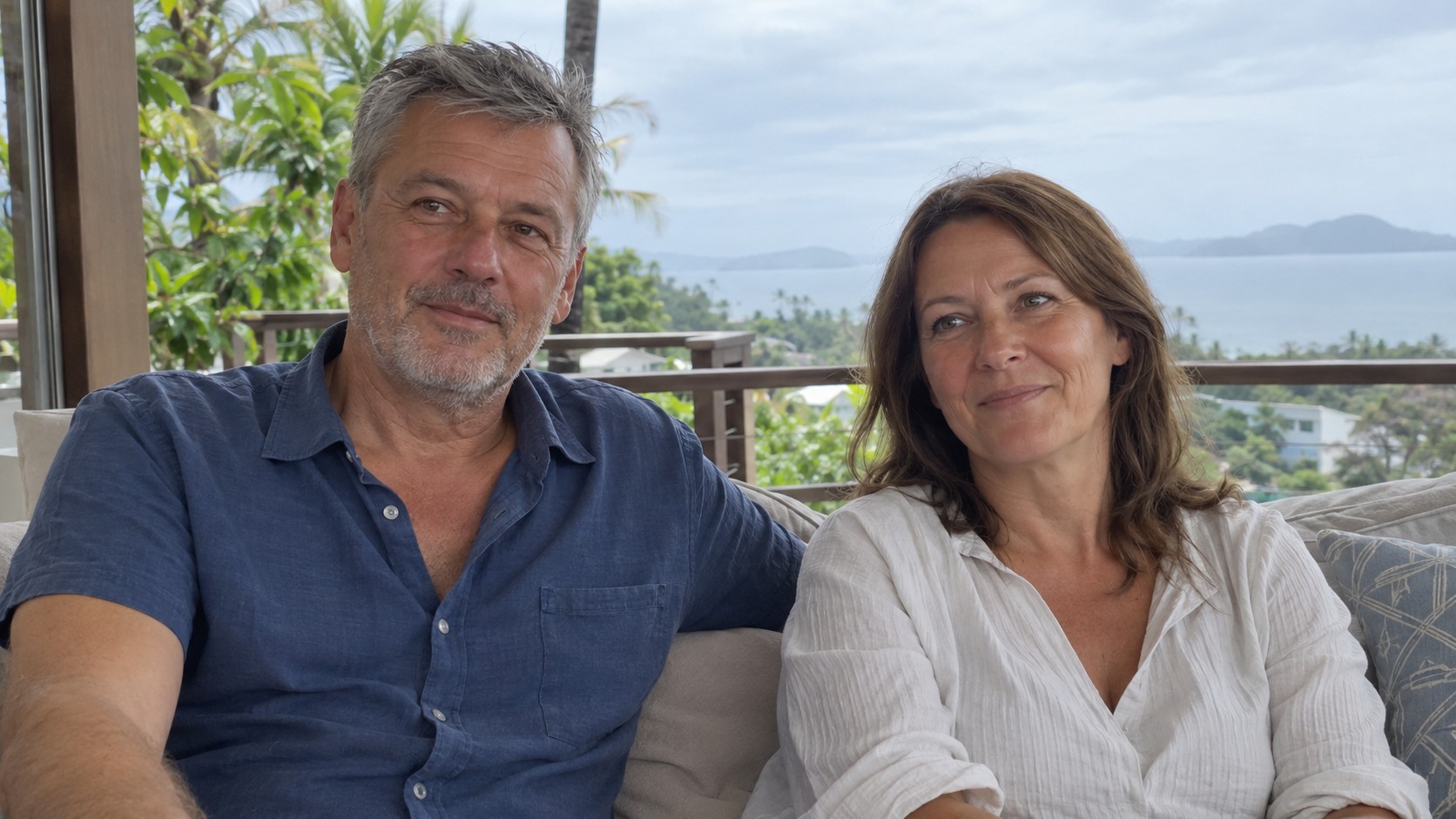 Illustrative couple seated on a terrace overlooking Koh Samui