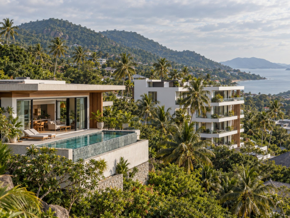 Private pool villa next to a low-rise condominium on a hillside in Koh Samui